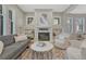 Inviting living room with fireplace, hardwood floors, built-in shelving, and stylish furniture at 549 N Ogden St, Denver, CO 80218