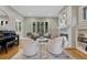 Bright living room with stylish decor, hardwood floors, a fireplace, and piano at 549 N Ogden St, Denver, CO 80218