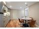 Basement kitchen with grey cabinets, stainless steel appliances, and an eat in table at 8903 Edgewood St, Highlands Ranch, CO 80130