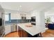 Beautiful kitchen featuring stainless appliances, quartz countertops, and stylish backsplash at 8903 Edgewood St, Highlands Ranch, CO 80130