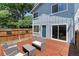 Inviting outdoor space with charming string lights, patio seating, and a well-maintained wood fence and deck at 2854 N Lowell Blvd, Denver, CO 80211
