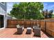 Inviting backyard featuring wooden deck with outdoor seating perfect for entertaining at 2854 N Lowell Blvd, Denver, CO 80211