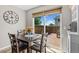 Bright dining area with hardwood table and chairs and a sliding door to the wooden patio at 2854 N Lowell Blvd, Denver, CO 80211