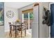 Cozy dining room features wood table set, a view of the backyard, and lovely decor at 2854 N Lowell Blvd, Denver, CO 80211