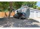 Spacious four-car garage with ample parking and black SUV parked in the driveway at 2854 N Lowell Blvd, Denver, CO 80211