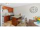 Kitchen with granite countertop island and dark wood cabinets featuring stainless steel appliances at 2854 N Lowell Blvd, Denver, CO 80211