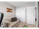 Inviting home office with a cozy armchair, wooden decor, and spacious closet for storage at 2854 N Lowell Blvd, Denver, CO 80211