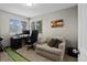 Bright home office with modern desk setup, comfortable armchair, and natural light from the window at 2854 N Lowell Blvd, Denver, CO 80211