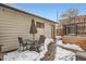 Enclosed backyard with a patio set and snow covered grounds at 201 S Logan St, Denver, CO 80209