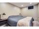 Bedroom with cozy carpeted floors and a comfortable bed at 201 S Logan St, Denver, CO 80209