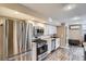 Modern kitchen with stainless steel appliances and sleek cabinetry at 201 S Logan St, Denver, CO 80209