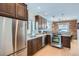 Well-equipped kitchen with stainless steel appliances, granite countertops, and ample cabinetry at 201 S Logan St, Denver, CO 80209