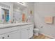Bright bathroom with double sinks, white cabinetry, and modern fixtures, providing a functional space at 9694 Truckee St, Commerce City, CO 80022