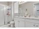 Bathroom featuring a glass-enclosed shower, double sink vanity, and modern fixtures for a luxurious and functional space at 9694 Truckee St, Commerce City, CO 80022