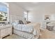 Bright and airy bedroom featuring a large bed, vanity area, and ample natural light for a serene and stylish space at 9694 Truckee St, Commerce City, CO 80022