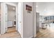 Convenient interior view leading to a laundry room equipped with modern appliances, making chores a breeze at 9694 Truckee St, Commerce City, CO 80022