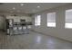 An open floor plan seamlessly connects the living room with the kitchen, complete with modern finishes and ample natural light at 9694 Truckee St, Commerce City, CO 80022
