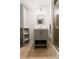 Bathroom featuring grey vanity with mirror and modern lighting, next to glass enclosed shower at 1120 N Clarkson St # 6, Denver, CO 80218