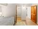 Comfortable bedroom featuring hardwood floors, a plush rug, and a spacious closet at 1120 N Clarkson St # 6, Denver, CO 80218