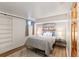 Cozy bedroom with soft rug, comfortable bed, and lots of natural light at 1120 N Clarkson St # 6, Denver, CO 80218