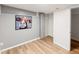 Cozy bedroom with vinyl plank floors, a closet, and a whimsical cow painting at 1120 N Clarkson St # 6, Denver, CO 80218
