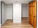 Hallway with luxury vinyl plank floors and entry to closet with bi-fold door at 1120 N Clarkson St # 6, Denver, CO 80218