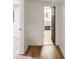 Hallway with luxury vinyl plank floors with view to bath with tile floors at 1120 N Clarkson St # 6, Denver, CO 80218