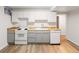 Functional kitchen with wooden countertops, white appliances, and ample storage space at 1120 N Clarkson St # 6, Denver, CO 80218