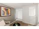 Inviting sitting area featuring a chair, small table, and view into the next room at 1120 N Clarkson St # 6, Denver, CO 80218