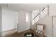 Comfortable sitting area featuring a chair, small table, and view of the staircase at 1120 N Clarkson St # 6, Denver, CO 80218