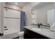 Well-appointed bathroom with a granite-topped vanity, sink, and a shower-tub combo at 8861 Ventura St, Commerce City, CO 80022