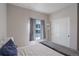 Cozy bedroom with a queen bed, plush bedding, bright window, and ample closet space at 8861 Ventura St, Commerce City, CO 80022