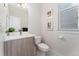 Modern half bathroom with sleek vanity, stylish fixtures, and clean lines, perfect for guests at 2922 W 26Th Ave # 1, Denver, CO 80211