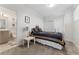 A bedroom featuring elegant black and gold bedding with an attached bathroom and closet at 2922 W 26Th Ave # 1, Denver, CO 80211