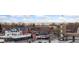 Panoramic city view featuring mountain vistas and clear blue skies above buildings and parked cars at 2922 W 26Th Ave # 1, Denver, CO 80211