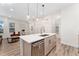 Bright, open kitchen featuring a large island, modern appliances, and seamless access to the living spaces at 2922 W 26Th Ave # 1, Denver, CO 80211