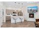 Contemporary kitchen with a large island, stainless steel appliances, fireplace, and open layout at 2922 W 26Th Ave # 1, Denver, CO 80211