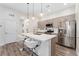 Modern kitchen with stainless steel appliances, a spacious island, and breakfast bar seating at 2922 W 26Th Ave # 1, Denver, CO 80211