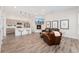 Bright, open-concept living room and kitchen, perfect for modern living and entertaining with warm decor at 2922 W 26Th Ave # 1, Denver, CO 80211