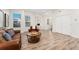 Inviting living room with ample natural light, featuring comfortable seating, wood floors, and contemporary decor at 2922 W 26Th Ave # 1, Denver, CO 80211