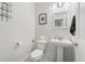 Clean powder room featuring a pedestal sink, modern fixtures, and decorative accents at 2922 W 26Th Ave # 1, Denver, CO 80211