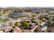 A view of solar panel parking, green spaces, and sidewalks with residential homes at 9804 Martin Luther King Blvd, Denver, CO 80238