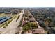 A neighborhood aerial view with sidewalks, trees, and solar panels at 9804 Martin Luther King Blvd, Denver, CO 80238