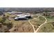 Wide aerial view of the building's exterior surrounded by sidewalks and green space at 9804 Martin Luther King Blvd, Denver, CO 80238