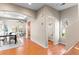 Hallway featuring an open dining and living room area and a half bathroom at 9804 Martin Luther King Blvd, Denver, CO 80238