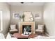 Inviting living room showcases a fireplace with mantle and cozy seating arrangement for relaxation at 9804 Martin Luther King Blvd, Denver, CO 80238