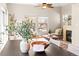 Open-concept living area connects the dining space and inviting living room with cozy fireplace at 9804 Martin Luther King Blvd, Denver, CO 80238
