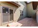 Exterior shot of a private patio with access to the home's interior through sliding glass doors at 9804 Martin Luther King Blvd, Denver, CO 80238