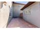 Exterior view of private patio with stamped concrete flooring and access to the home's exterior at 9804 Martin Luther King Blvd, Denver, CO 80238