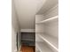 Storage space with built-in shelves and wooden floor at 9804 Martin Luther King Blvd, Denver, CO 80238